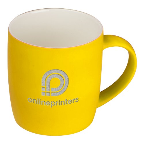 Gelbe Keramiktasse mit Henkel.
