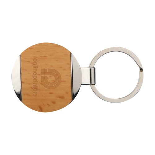 Brauner Metall-Holz-Schlsselanhnger mit Muster und Metallring.
